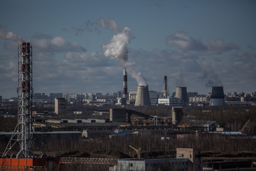 view from the roof of a high-rise building on an industrial area on the outskirts of a city