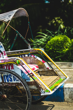 Indonesian Traditional Transportation - Becak (Tuk-Tuk) or Cycle Rickshaw, waiting for customers