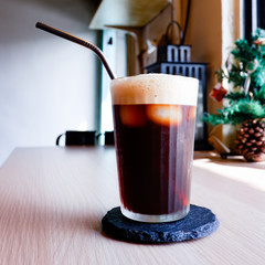 A glass of iced Americano, black coffee