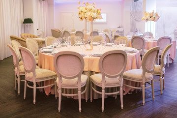 Table setting for an event party or wedding reception. Table settings for a luxury wedding. Indoor wedding