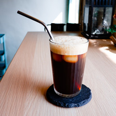 A glass of iced Americano, black coffee