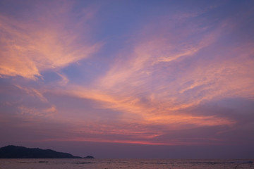 Ocean shore in purple sunset. Twilight.