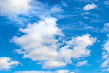 Naklejka na ściany i meble White clouds in the blue sky in sunny weather_