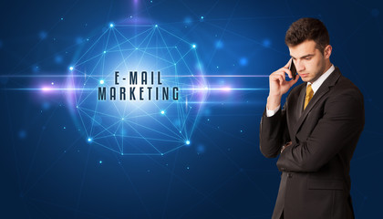 Businessman thinking about security solutions with E-MAIL MARKETING inscription