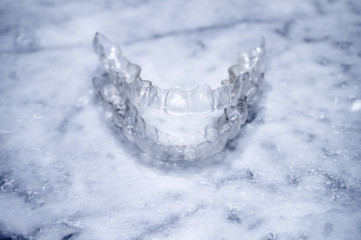 Transparent plastic splint for dental alignment