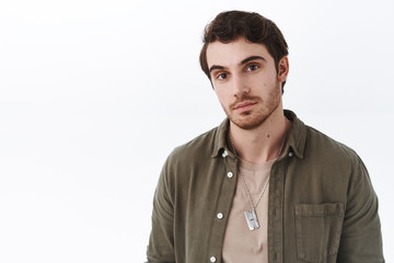 Obraz premium Close-up portrait handsome hopeless romantic looking forward meet his soulmate, looking camera and make small dreamy smile, casually standing in informal outfit over white background