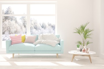 Modern living room in white color with sofa and winter landscape in window. Scandinavian interior design. 3D illustration