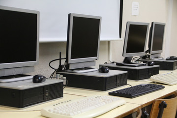 interior of a classroom with row of computers
