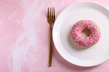pink donut on a white plate