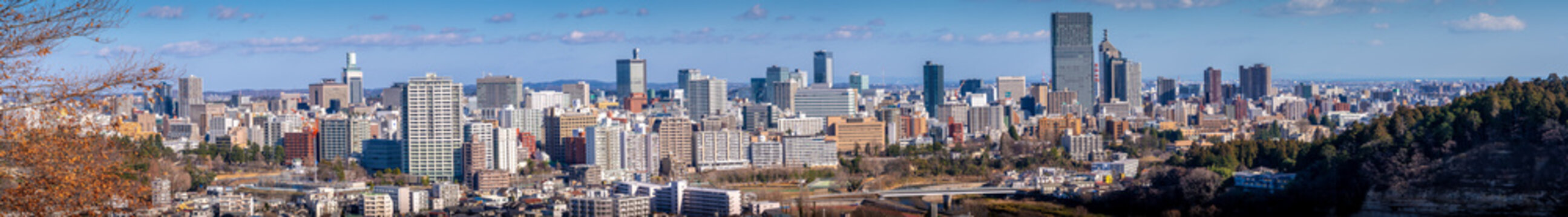 Panoramic photo of Sendai City from high angle in Daytime with bright bluesky and cloud