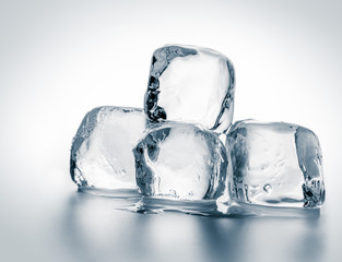 Group of natural crystal clear melting ice cubes on white background.