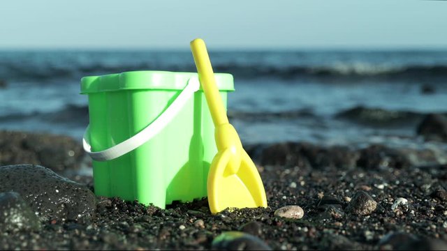 bucket and spade on a beach