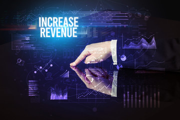 Businessman touching huge screen with INCREASE REVENUE inscription, cyber business concept