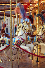 Traditional classic French styled vintage colorful horse carousel in the town square