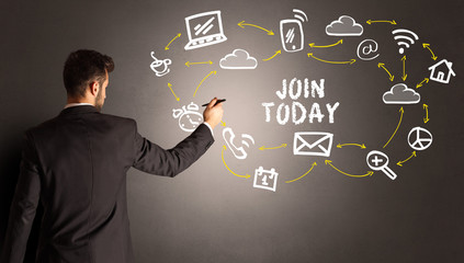 businessman drawing social media icons with JOIN TODAY inscription, new media concept