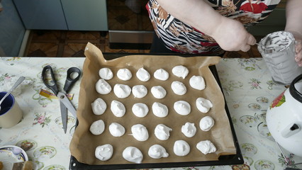 woman holding a tray of cookies
