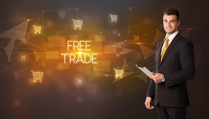 Businessman with shopping cart icons and FREE TRADE inscription, online shopping concept