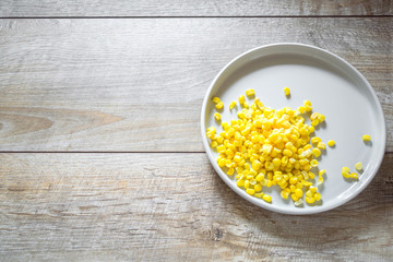 vegetables, corn served on gray plate on wooden table. food rustic background, copy space, flatlay, minimal style