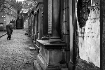 An spooky black and white photograph taken in the graveyard close to the Edinburgh castle in Scotland.