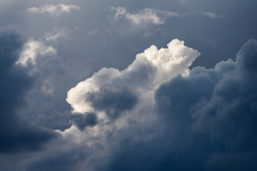 Fototapeta premium A detailed and dramatic close up shot of stormy sunlit clouds taken in the Madikwe Game Reserve, South Africa.