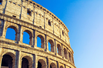 Colosseum at blue sky in Rome, Italy, Europe.