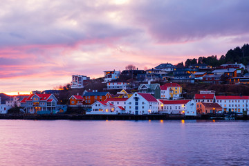 View of city center of Kristiansund, Norway during the cloudy morning at sunrise with colorful sky
