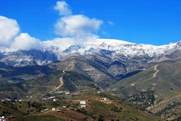 Fototapeta na wymiar View across the countryside towards snow capped mountains, Salares, Spain.