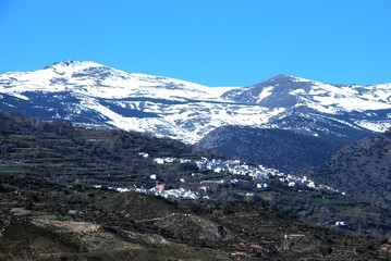 View of the town and countryside with snow capped mountains to the rear, Alcutar, Spain.