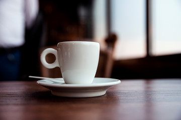 Coffe Cup on the Wooden Table  in the Caffee Bar
