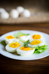 boiled eggs with salad leaves in a plate