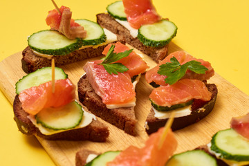 Red Trout Fish. Sandwiches with red fish. Sandwiches with trout or salmon, butter and cucumber.