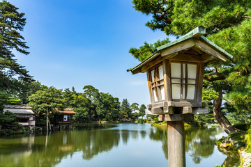 Close up of a wooden lantern at Kenrokuen garden in Kanazawa. It is considered one of the three most beautiful gardens of Japan.