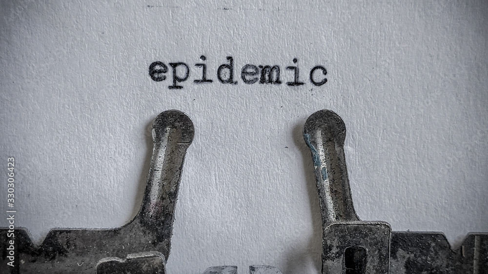 Fototapete epidemic text typed on blank sheet with an old typewriter in vintage background