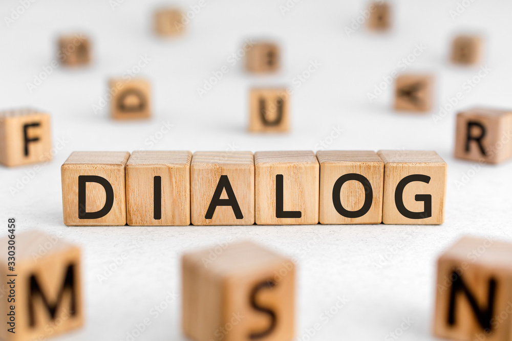 Poster dialog - word from wooden blocks with letters, dialogue interlocution dialog concept, random letters