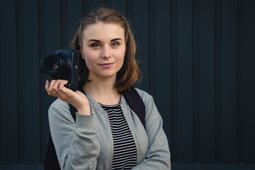Female photographer with a quiet friendly smile