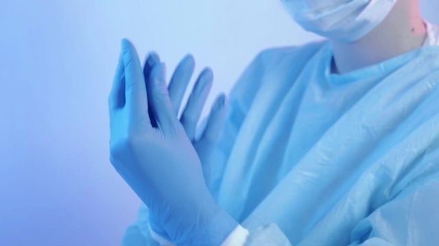 Influenza treatment. Acute respiratory distress syndrome. Female doctor wearing protective gloves.