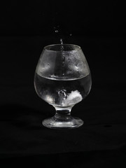 Dissolution of aspirin in a glass of water