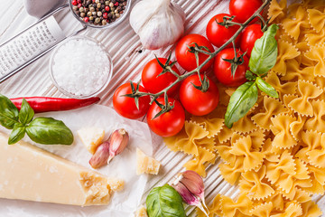concept of traditional italian pasta with tomatoes and basil