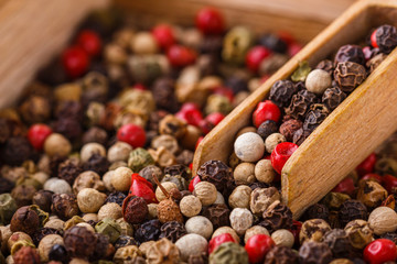 mix of peppercorns on white acrylic background