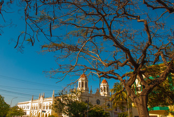 HAVANA, CUBA- MARCH 2018: Cuban landscape with a view of a beautiful Catholic Church on a local street