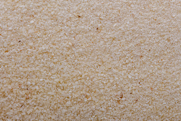 natural organic semolina on white acrylic background