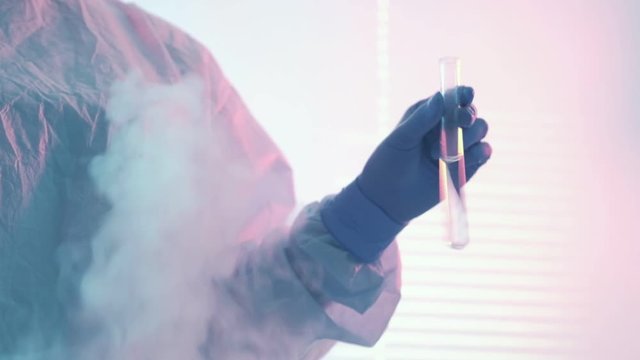Vaccine development. Pharmaceutical lab research. Female technician testing drugs in tube.
