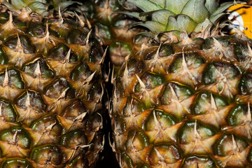 Raw pineapple fruits pile (ananas fruits)