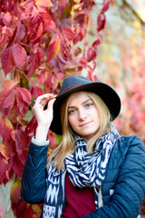 Beautiful young woman is walking in the park. Young woman enjoying nature