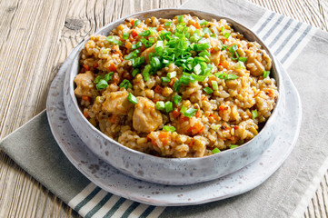 mung bean, rice, and chicken pilaf decorated with green onion
