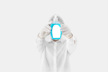 Doctor with medical mask with sanitizer gel. Mockup label of antibacterial soap