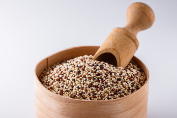 mix of quinoa grains on white acrylic background
