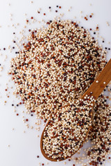 mix of quinoa grains on white acrylic background