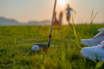 golf ball laying in the rough o grass meadow out of the fairway, being hit by the golfer revert to the fairway, difficult time of life find success forward