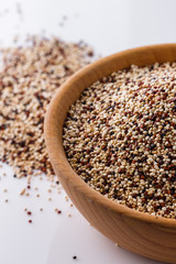 mix of quinoa grains on white acrylic background